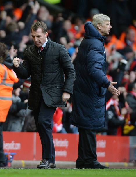 Brendan Rodgers esulta, mentre Wenger se la prende con i suoi. Epa